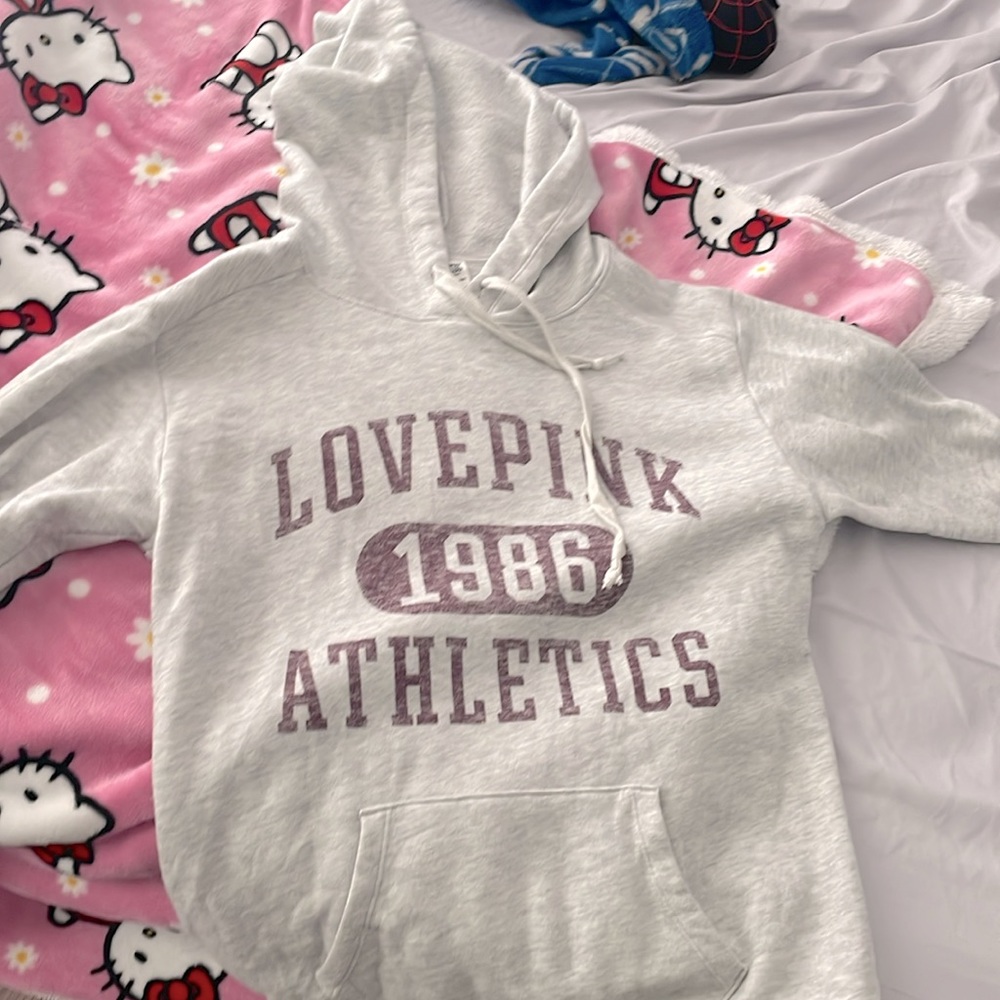 pink 1986 athletics sweatshirt